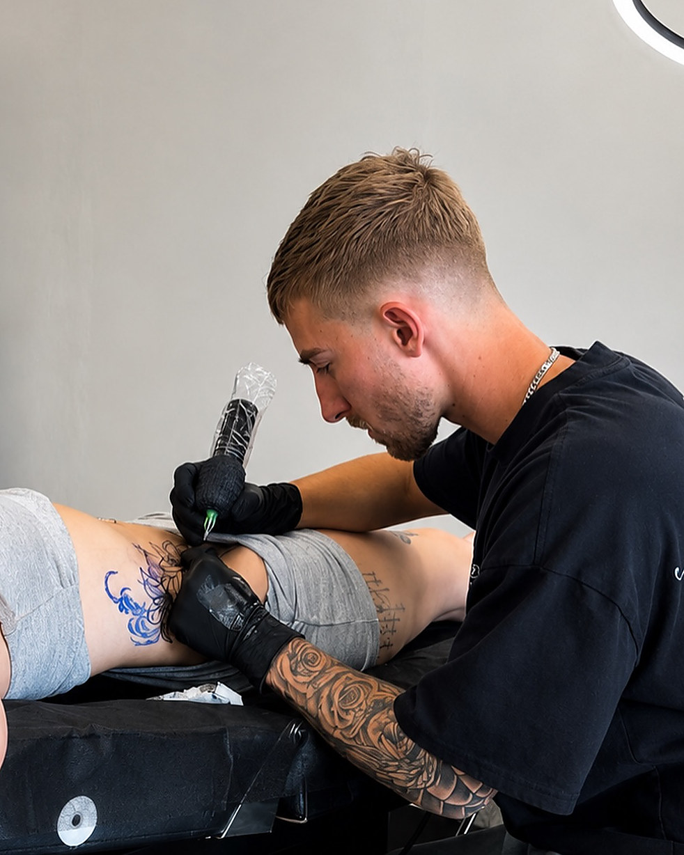 Kevin Lewis tattooing at Lewis Ink in Elkton