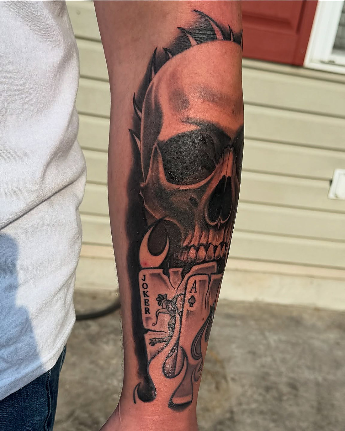 Owen Lewis forearm piece: the lower half healed, the upper half fresh from the second session