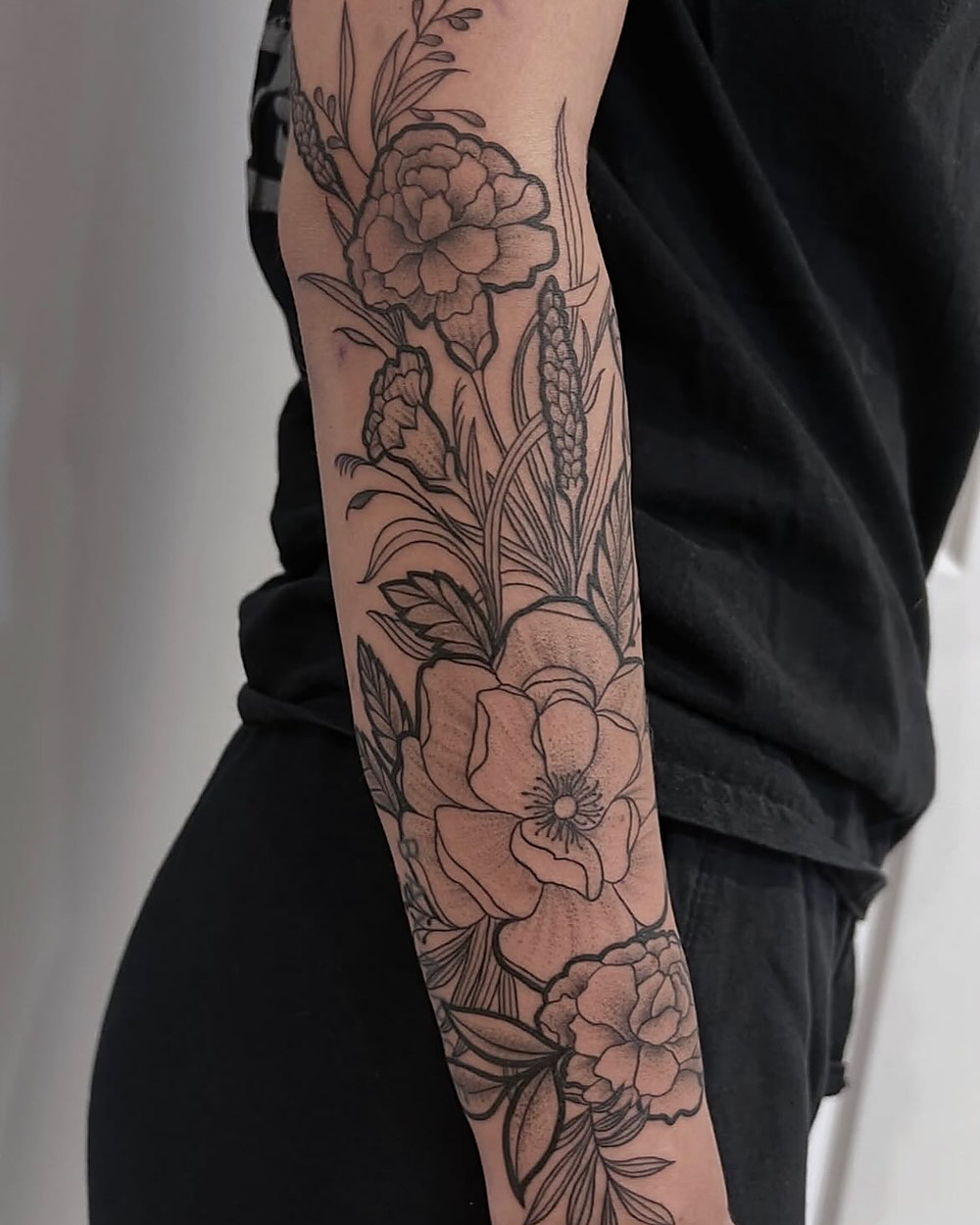 Fine line floral half sleeve, by Kevin Lewis