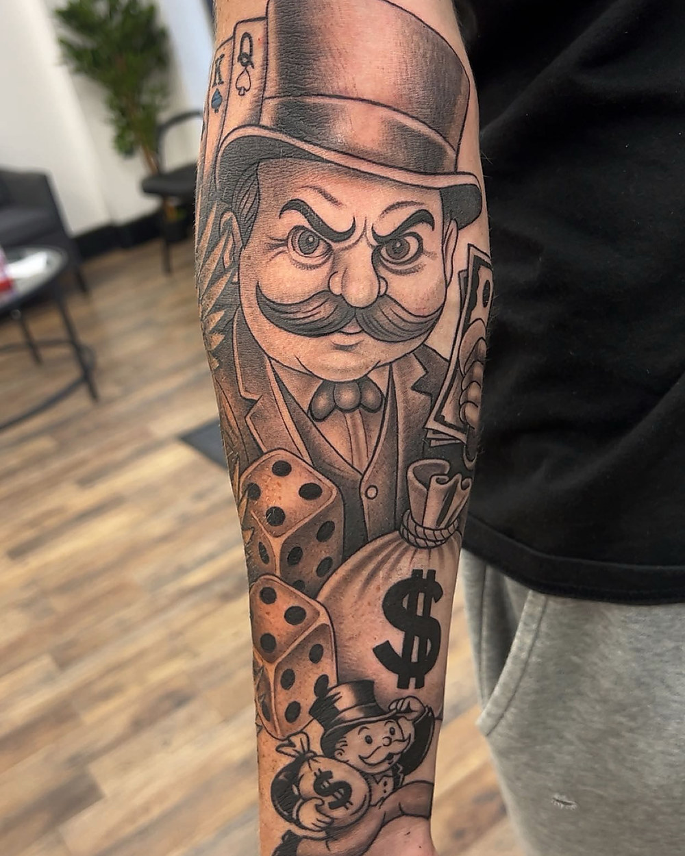 Top hat, dice and cards forearm piece, by Kevin Lewis