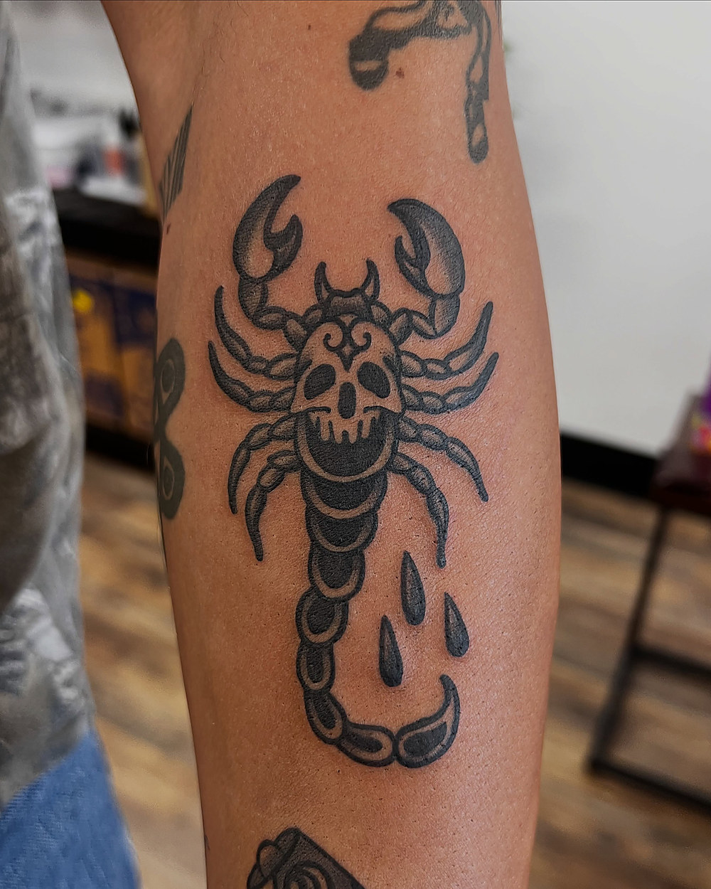 Traditional scorpion on a calf, by Kevin Lewis
